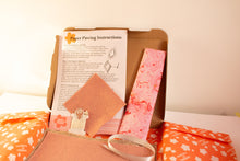 Load image into Gallery viewer, Crafting kit with EPP pieces, felt, fabric and instructions on a light background