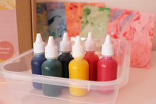 Load image into Gallery viewer, 6 different coloured marbling inks from the DIY Paper Marbling Kit, waiting to be used to unveil beautiful unique patterns