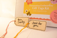 Load image into Gallery viewer, Freemotion embroidery gift tags with 'from Santa' and 'just for you' text, next to a kit box.