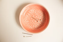 Load image into Gallery viewer, Decorative pink ceramic plate with intricate patterns on a light beige background